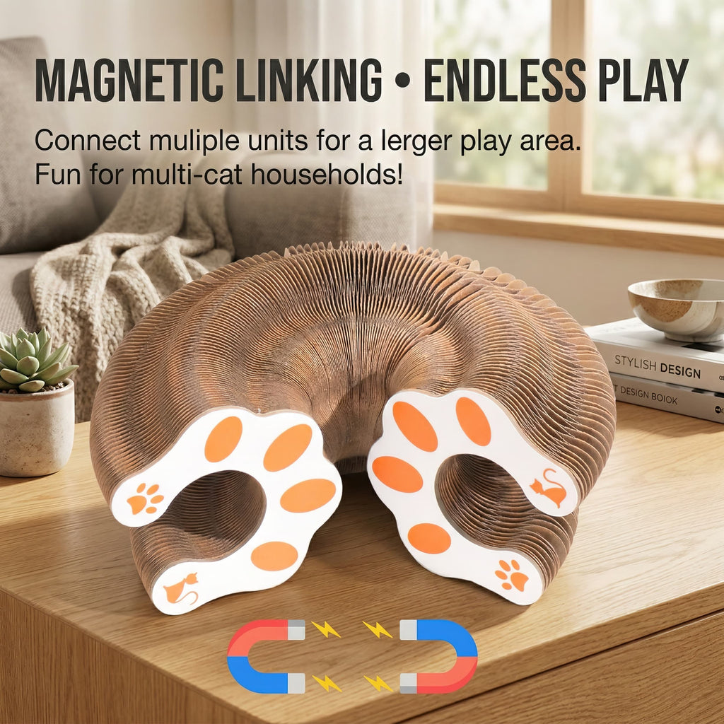 Cardboard cat play structure with magnetic linking feature on a wooden surface.