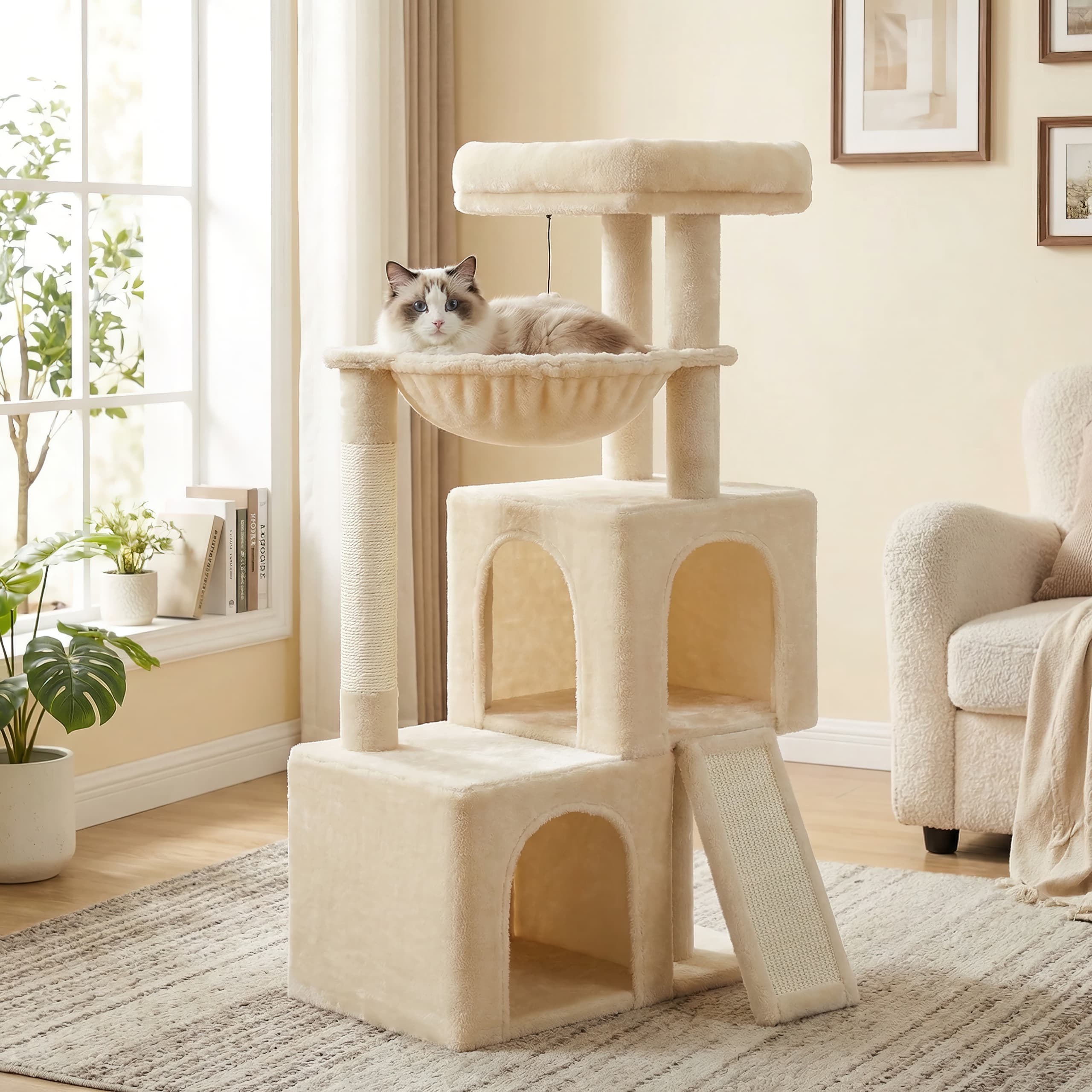 Cat tree with a cat sitting on a platform in a living room.
