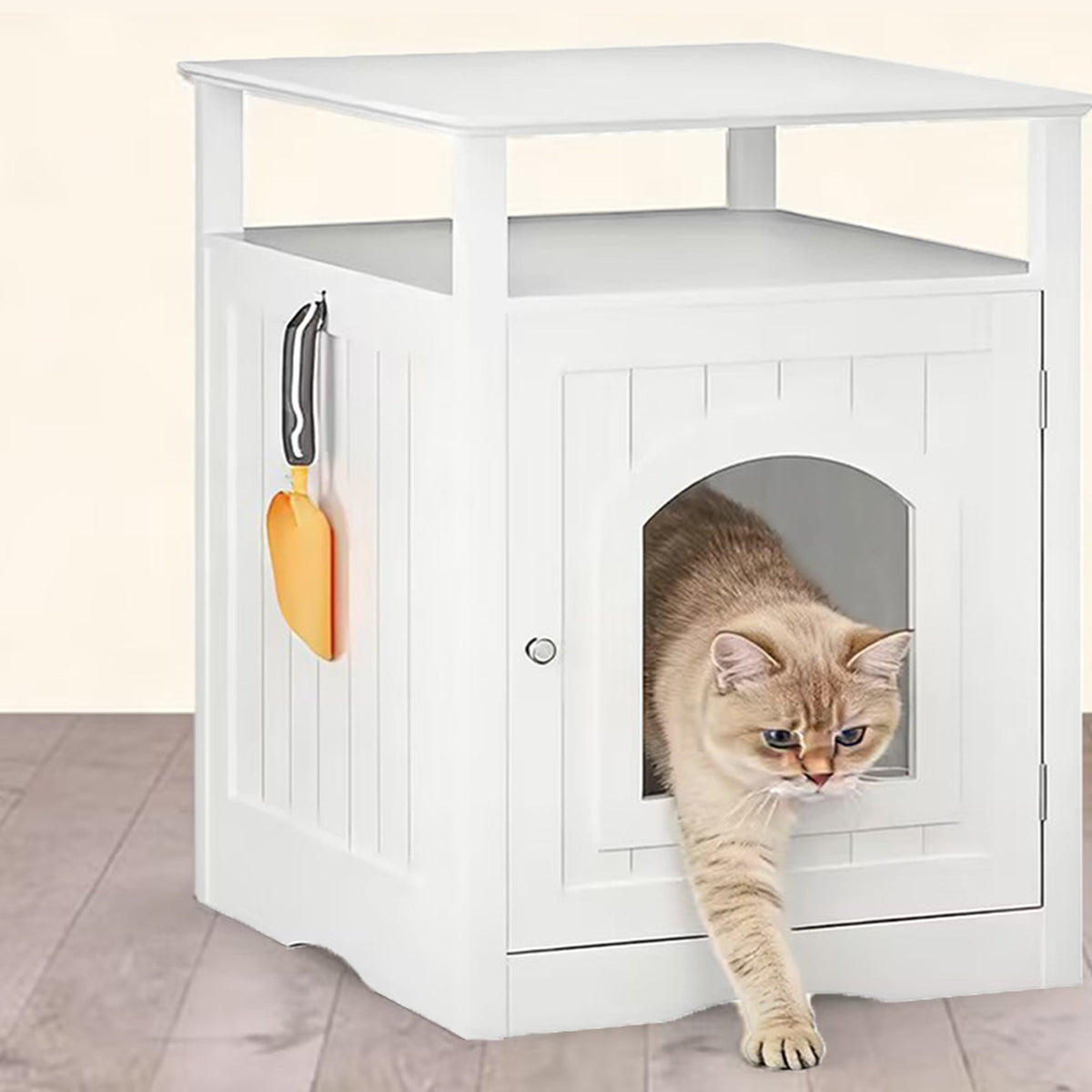 Cat exiting the white litter box enclosure