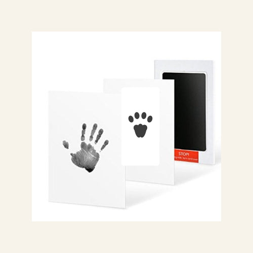 Clean-Touch keepsake kit with human handprint and cat paw print